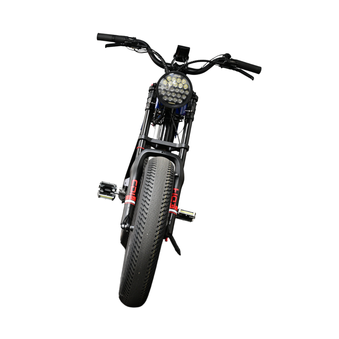 ANZA 1KW SR electric motorbike shown from above, featuring sleek black frame, high-rise handlebars, LED headlight cluster, wide CST Tourance tire, and performance pedals. Bird's eye view showcases classic cafe racer styling and premium build quality.