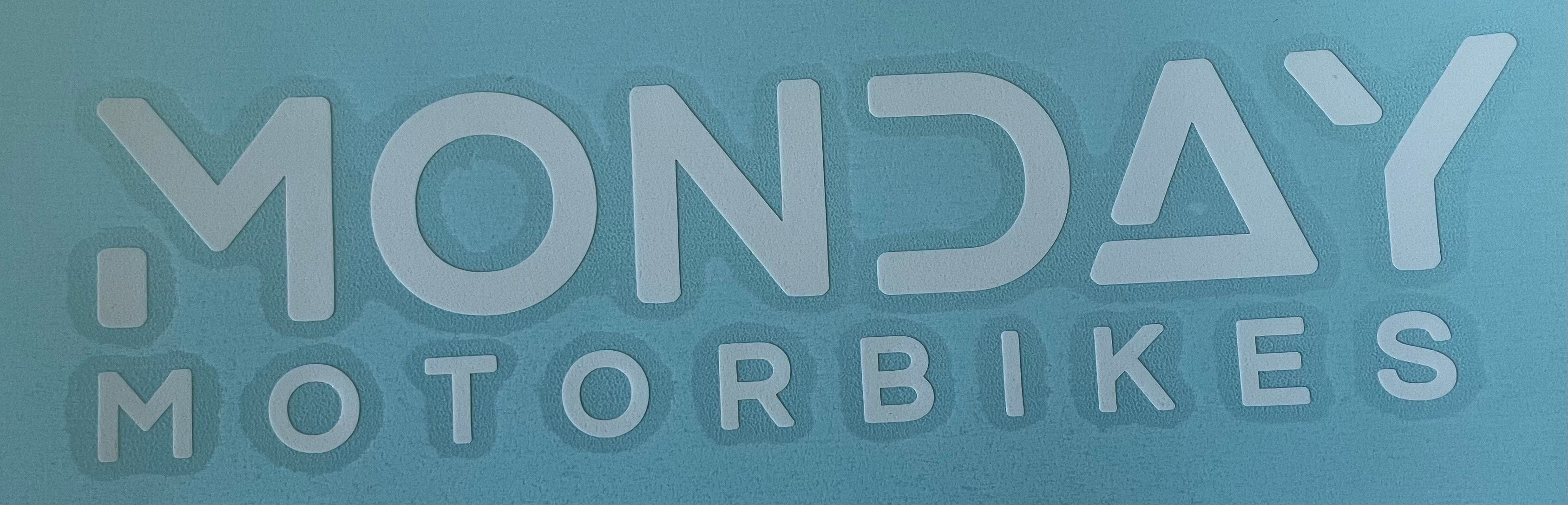 A white logo transfer sticker with a clean and modern design.