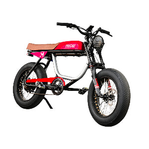 Anza 750W SR electric bike in red and black with cafe racer styling, featuring wide tires, tan leather seat, high-rise handlebars, and distinctive LED headlight. Side view showcasing the aluminum frame and classic motorcycle-inspired design.