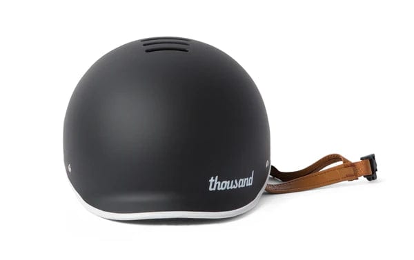 Rear perspective of a black bike helmet showcasing the safety lock system