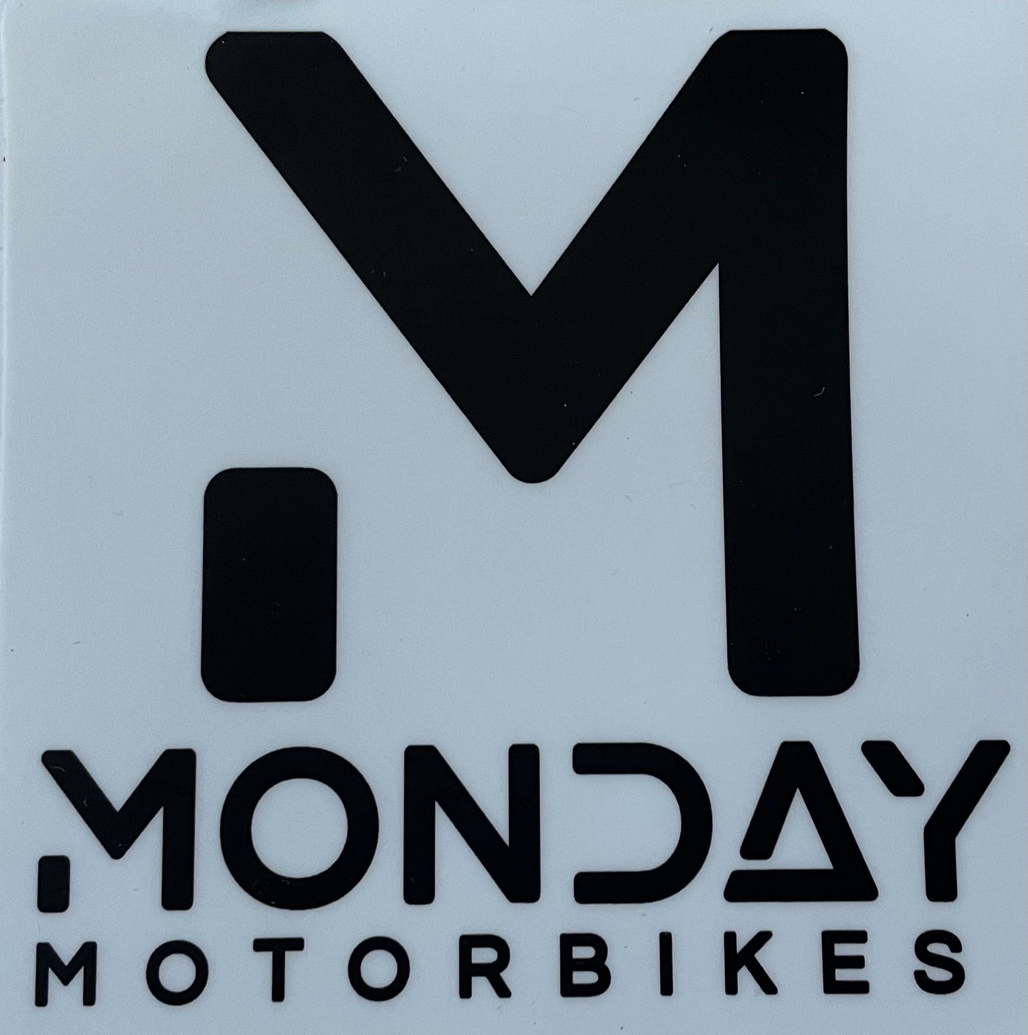 A set of rounded corner stickers featuring the Monday Motorbikes logo, perfect for customization.